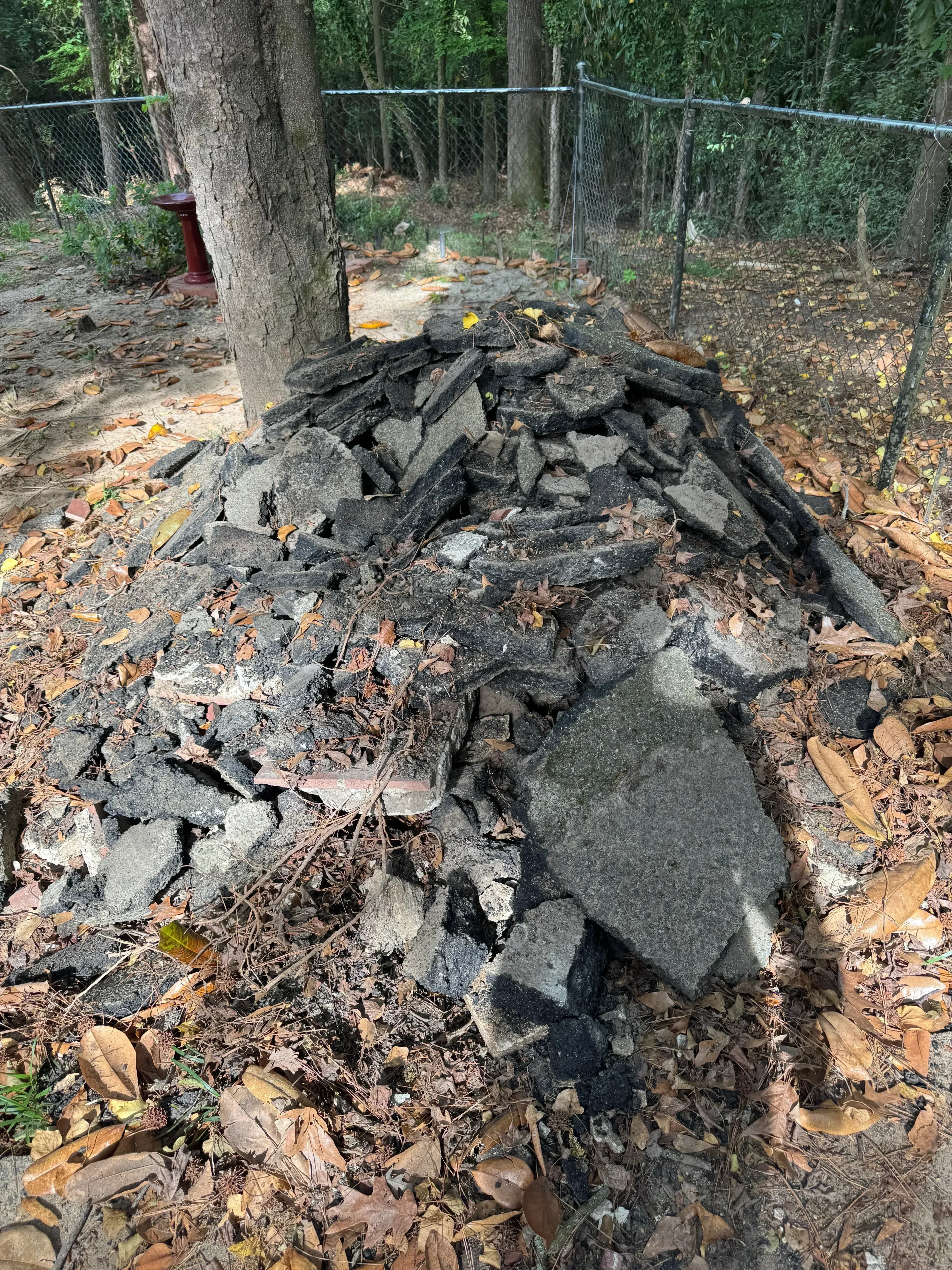 Broken concrete slabs and debris removal from residential demolition site