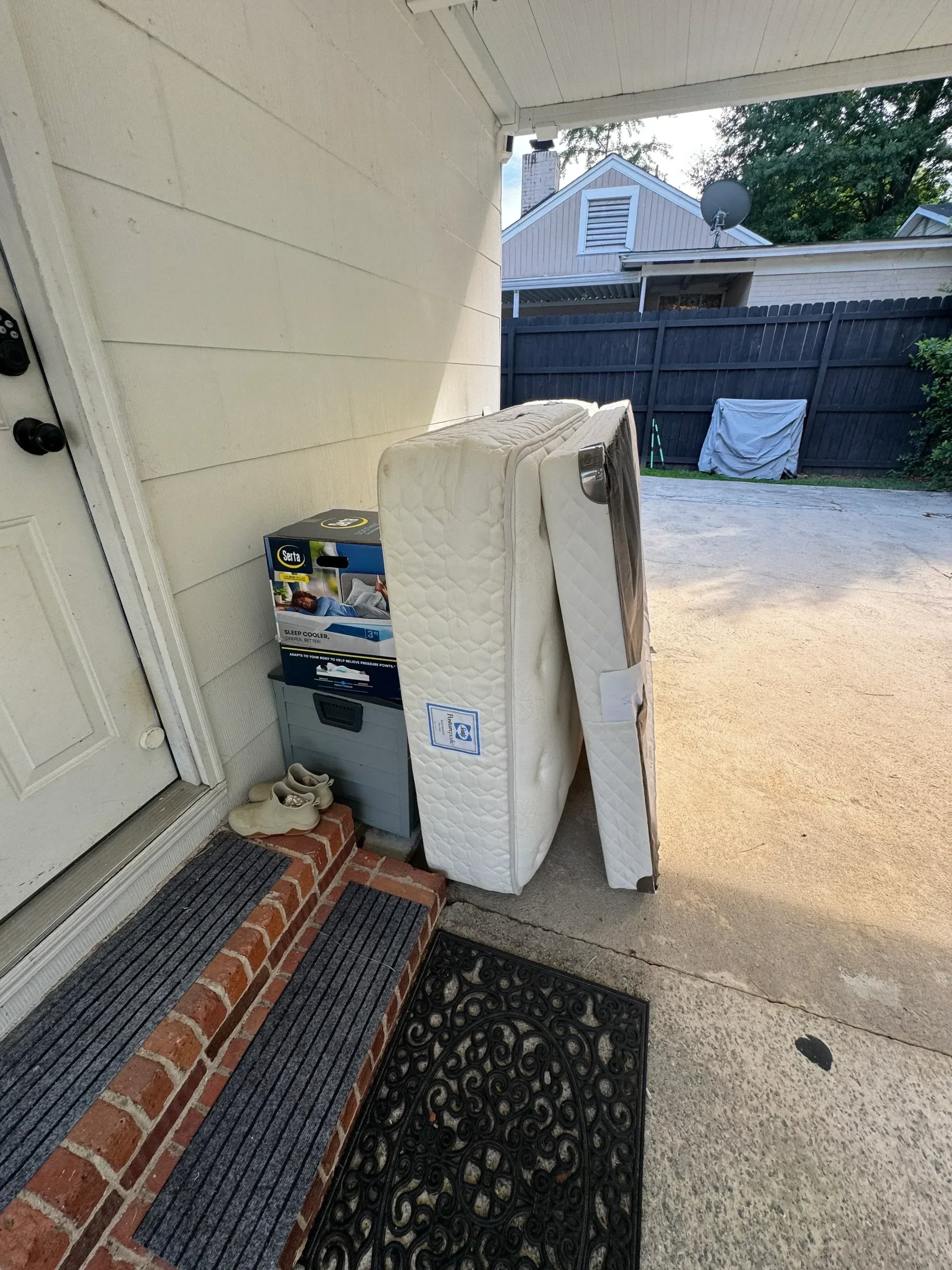 Full-size mattress and box spring removal from residential driveway