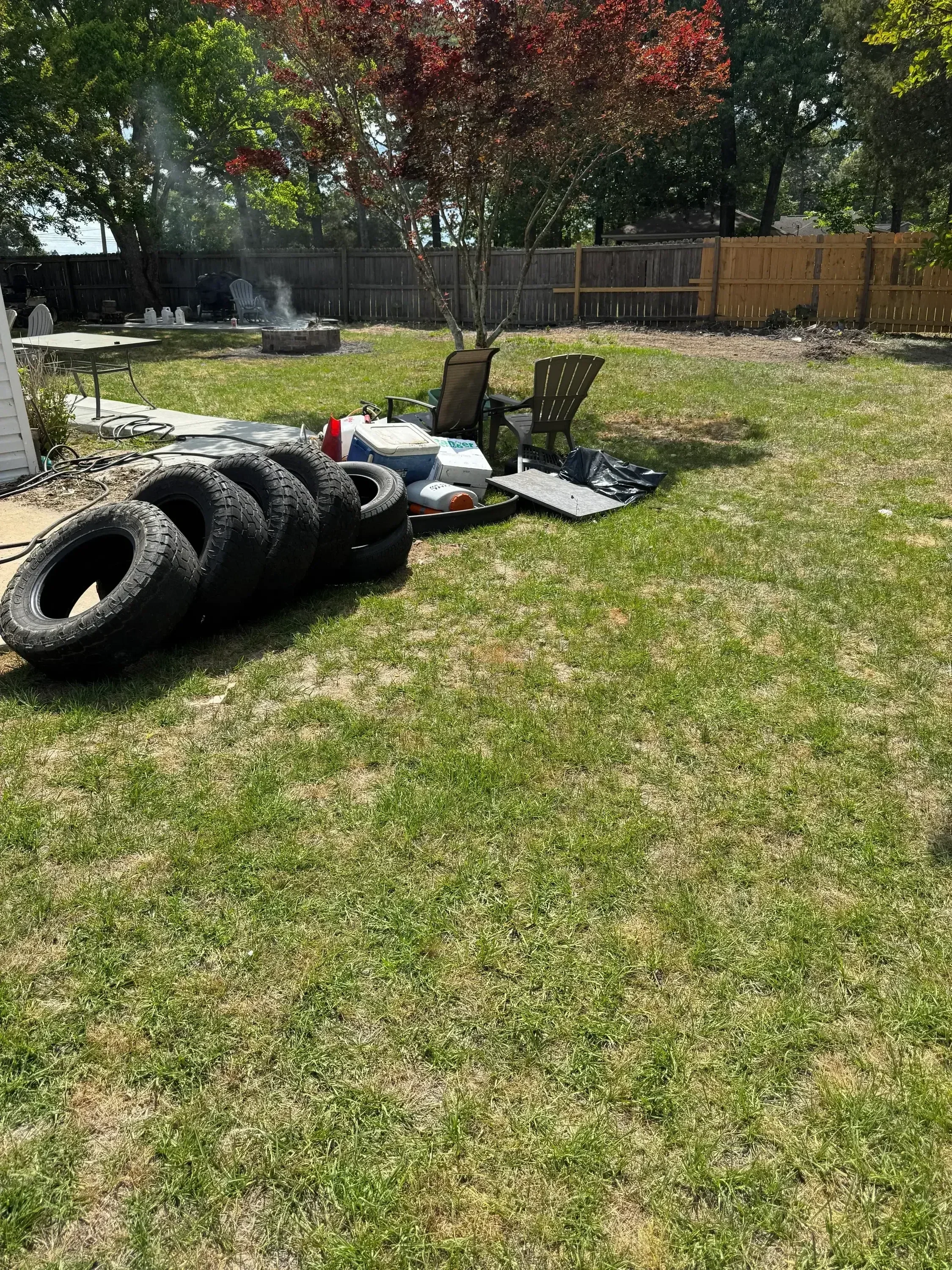 Commercial truck loaded with stacked used tires for removal and hauling